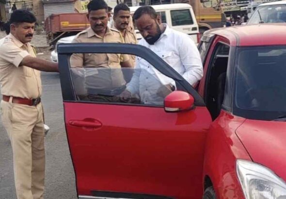 Ranjangaon Police Traffic Action : Traffic police checking car documents during road enforcement drive in India under Ministry of Road Transport and Highways rules